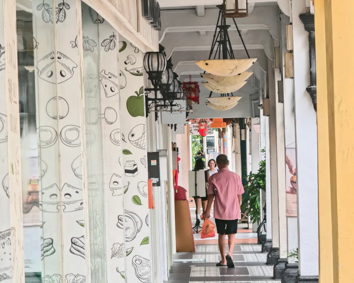 Five-foot-way walkway in Joo Chiat with local food illustrations and hanging lights