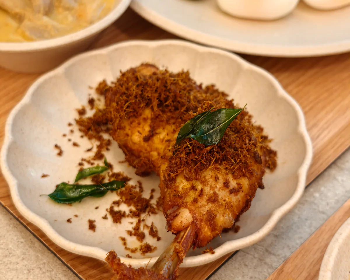 Crispy spiced chicken served as part of a local Singapore meal