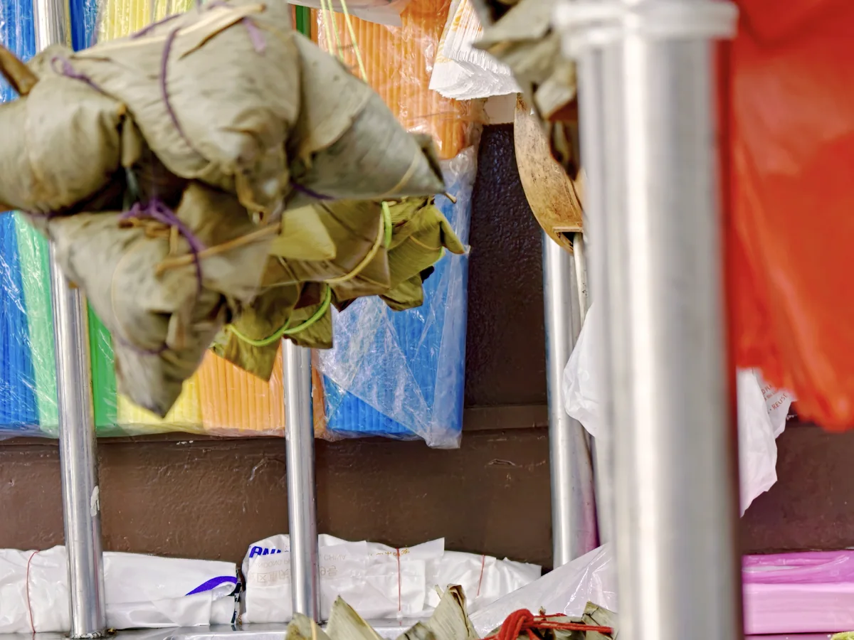 Zongzi wrapped in bamboo leaves at a Singapore wet market stall